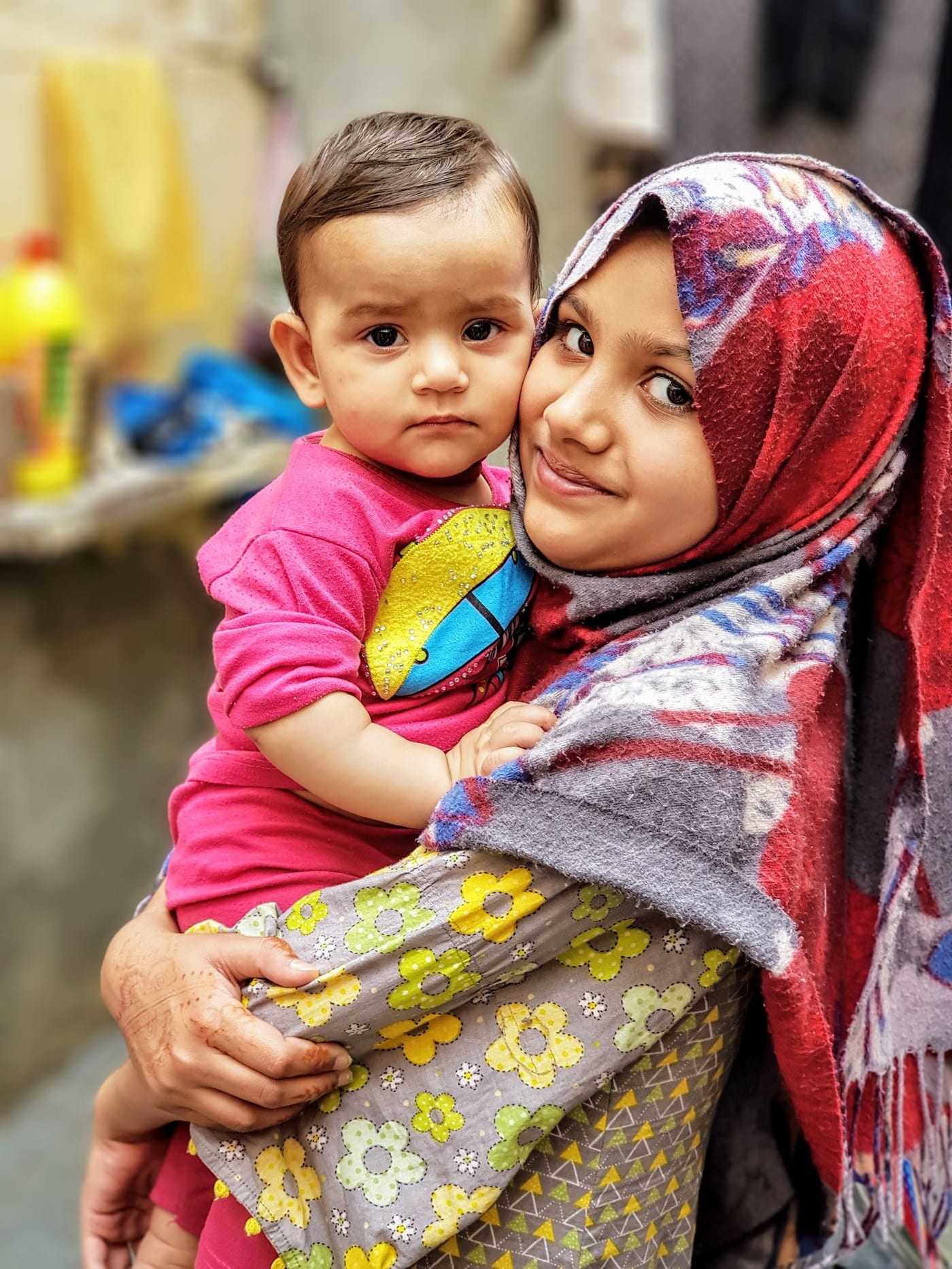 Pakistani mother holding her baby